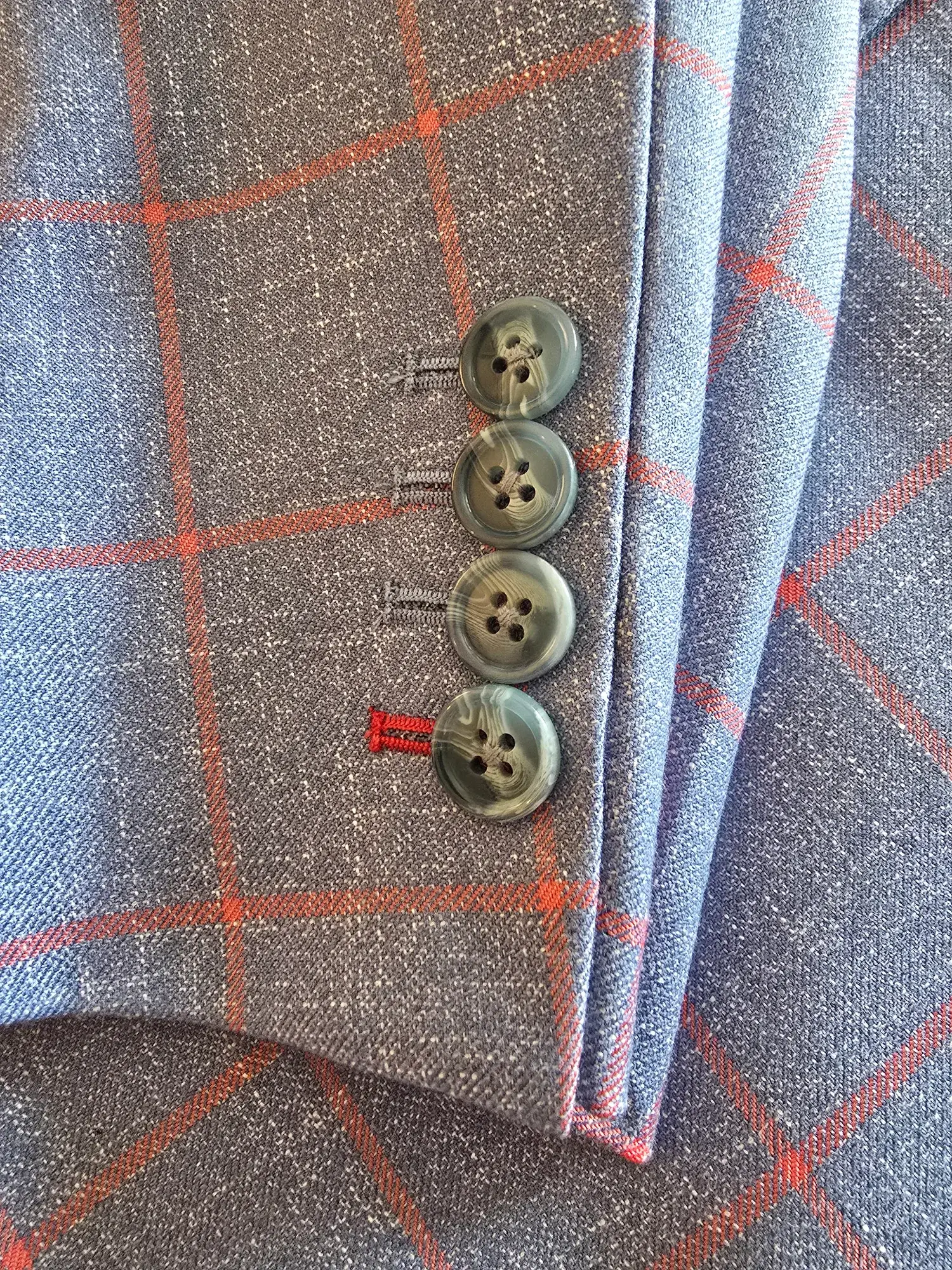 Cuff buttons and contrast stitching