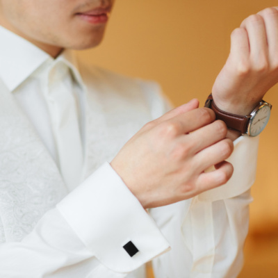 businessman clock clothes, businessman checking time on his wrist watch. mens hand with a watch, watch on a man's hand, putting the clock on the hand, fasten clock watch time, man's style.